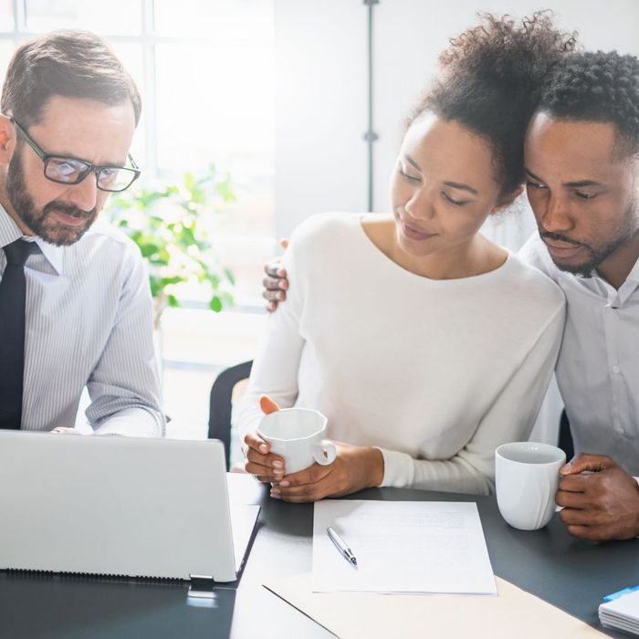 a couple meeting with a lawyer