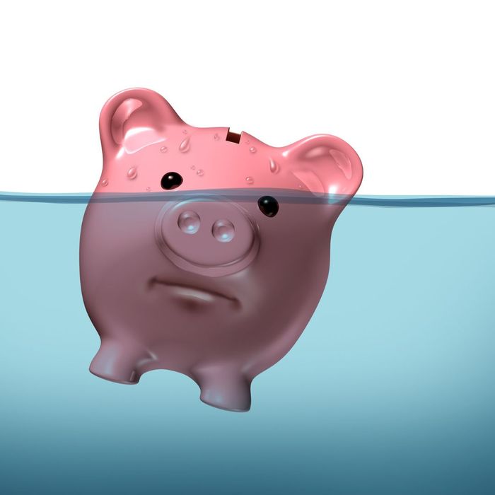 A piggy bank half submerged in water