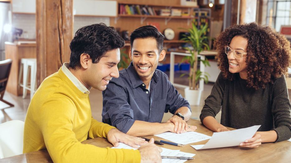 A couple meeting with a lawyer